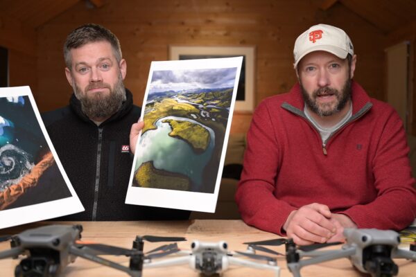 Jeroen Van Nieuwenhove and Nigel Danson discussing aerial prints with drones on a desk in the masterclass.