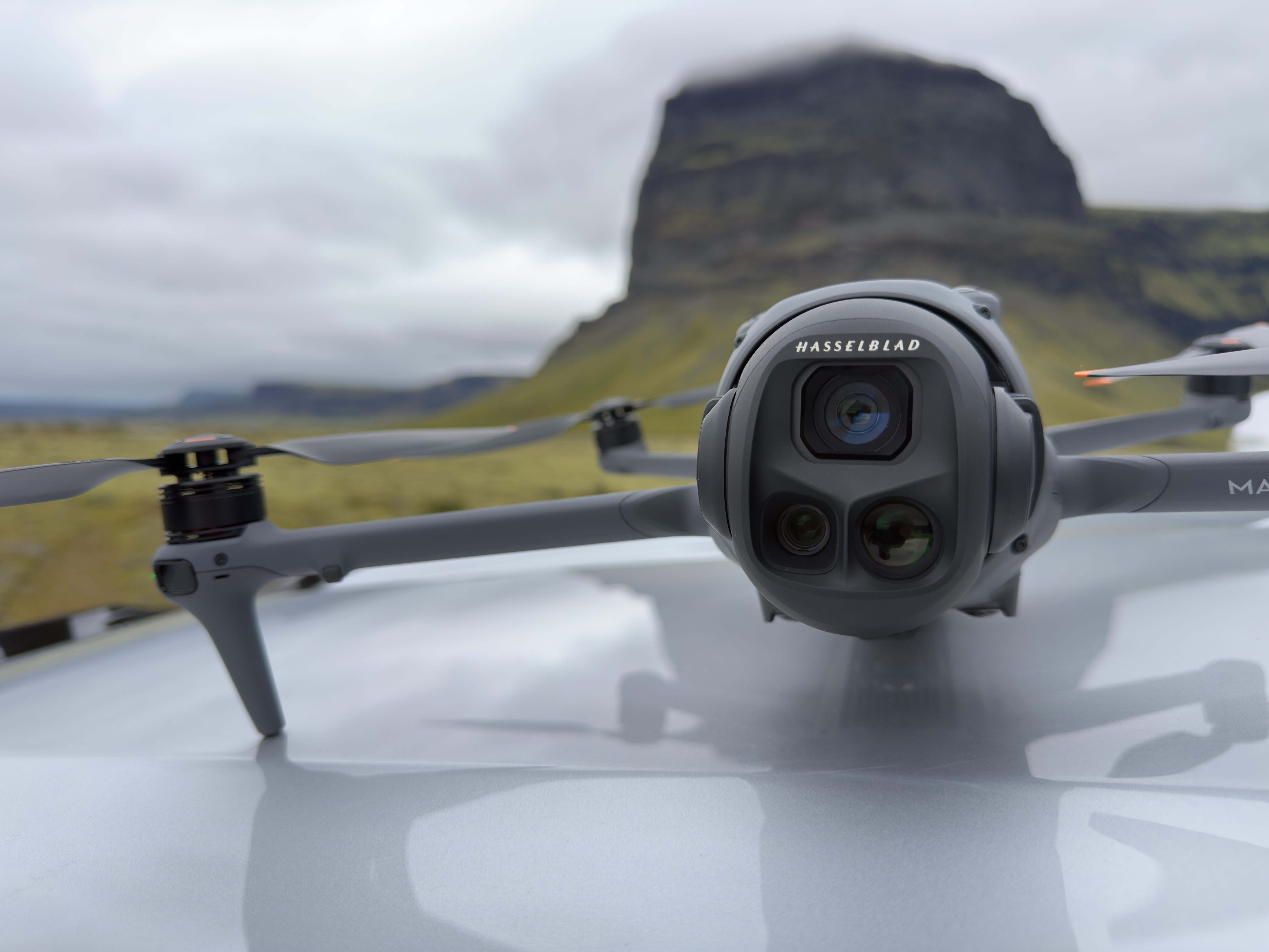 DJI Mavic 4 Pro drone sitting on the hood of my car before a flight in Iceland. This drone has the best drone camera in a prosumer drone.