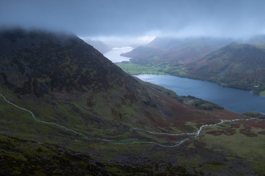 Panoramic view of Buttermere and Crummock Water under low cloud, Lake District fells.