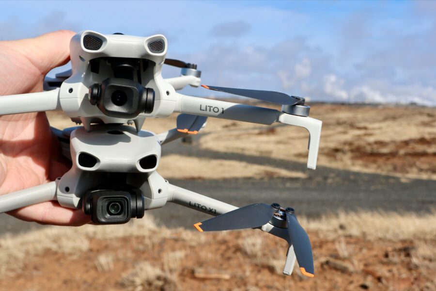 DJI Lito 1 stacked on top of the smaller Lito X1 held in hand on an Icelandic plain.
