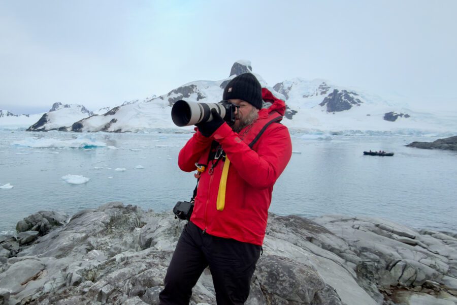 Jeroen Van Nieuwenhove photographing penguins in Antarctica with a Canon R6 Mark III and RF 100-500mm.